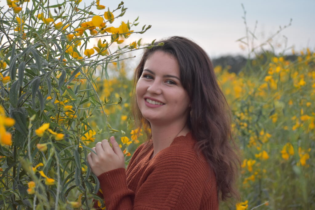 girl smiling in field